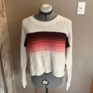 This multicolored knit sweater is cute and cozy!